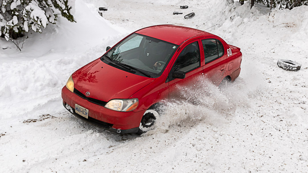 Red rally car drifting